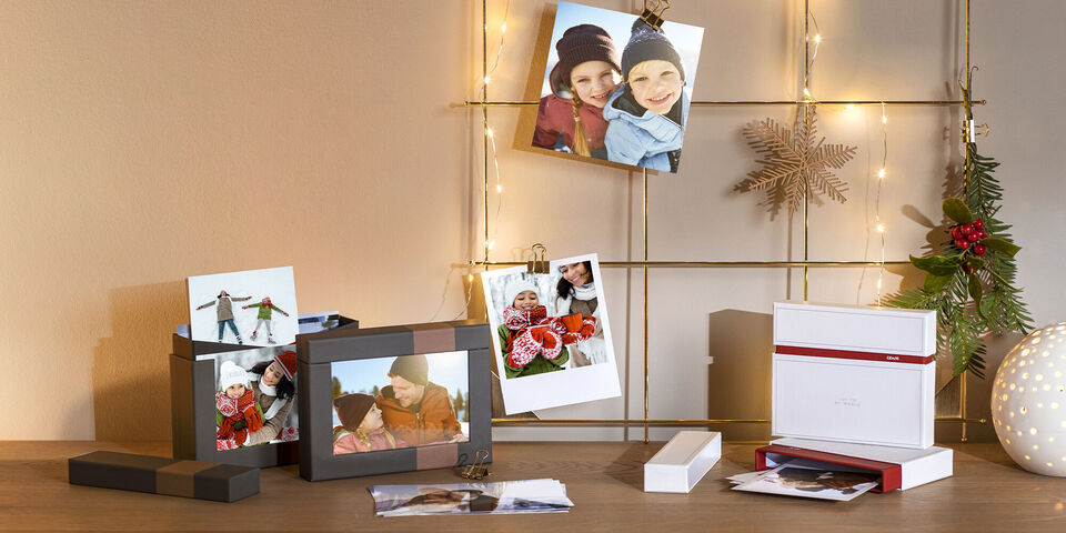 various photo print sizes on a desk