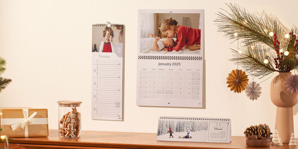 Selection of small to large photo calendars hanging on the wall